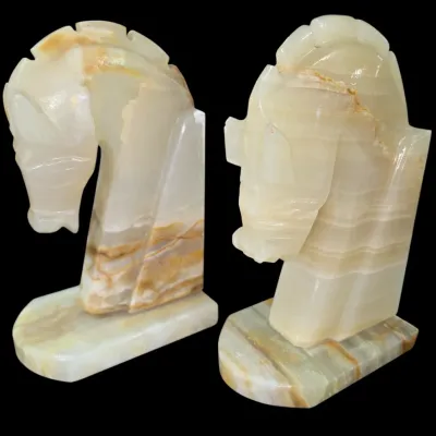 Sale Photo Thumbnail #148: Pair of vintage carved onyx horse head bookends featuring natural banded veining.
