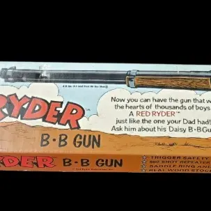 Sale Photo Thumbnail #71: Vintage Daisy Red Ryder B-B gun in its original illustrated box, accompanied by a small Red Ryder Junior Treasure Chest BB container.