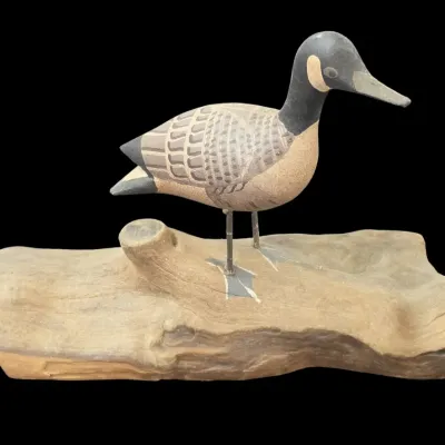 Sale Photo Thumbnail #39: Hand-carved and painted wooden shorebird carving mounted on a piece of natural driftwood base.