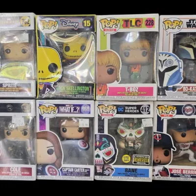 Sale Photo Thumbnail #117: Collection of twelve boxed Funko Pop! vinyl figures, featuring pop culture characters including Star Wars, Marvel, DC, and Disney.