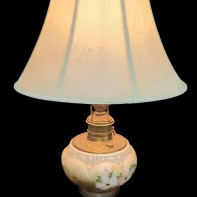 Sale Photo Thumbnail #60: Vintage electrified Gone with the Wind style table lamp featuring a hand-painted floral ceramic font on an ornate brass base, complete with a fabric shade.