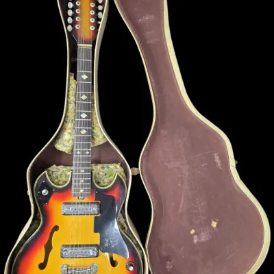Sale Photo Thumbnail #28: Vintage Teisco 12-string hollow body electric guitar in a sunburst finish, housed in its original hard shell case.