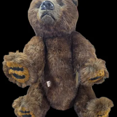 Sale Photo Thumbnail #119: Vintage Dee Bears realistic plush brown bear with jointed limbs and original tags attached.