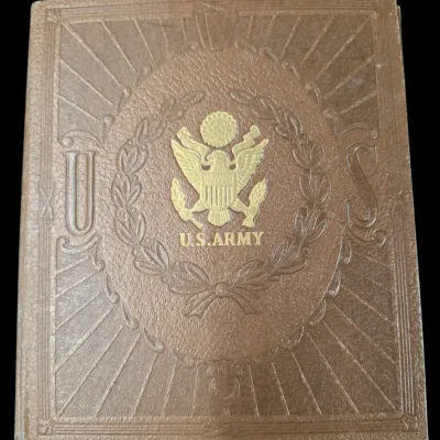 Sale Photo Thumbnail #113: Vintage U.S. Army embossed leatherette photo album cover featuring a gold-tone Great Seal emblem and wreath motif.