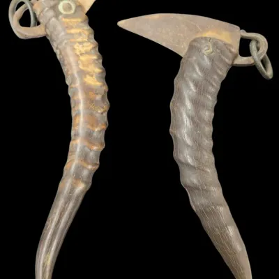 Sale Photo Thumbnail #95: Pair of antique folding pruning knives with carved horn handles and metal loop attachments.