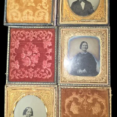 Sale Photo Thumbnail #134: Set of three antique 19th-century cased daguerreotype portraits featuring embossed velvet lining and ornate gilt metal mats.