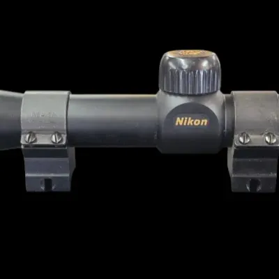 Sale Photo Thumbnail #132: Nikon Prostaff rifle scope with matte black finish and mounting rings attached.