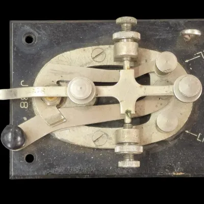 Sale Photo Thumbnail #98: Vintage US Army Signal Corps J-38 telegraph key mounted on a Bakelite base.