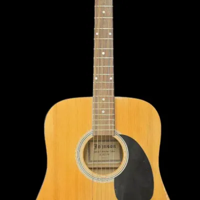 Sale Photo Thumbnail #57: Johnson acoustic guitar model JG-621-N with a natural finish body and black pickguard.