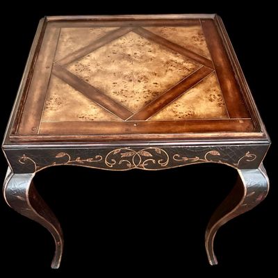 Sale Photo Thumbnail #127: Elegant pair of Rococo style side tables by Milling Road, a division of Baker Furniture. Featuring richly figured Burl wood parquet of tops, decorative japanned aprons with painted foliate detailing, and gracefully curved cabriole legs. A sophisticated co