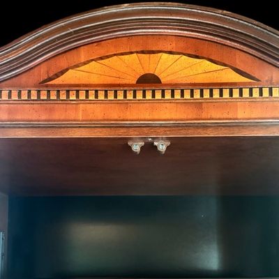 Sale Photo Thumbnail #125: Elegant banded entertainment armoire manufactured in the finest craftsmanship. The beautiful piece is crafted in richly figured wood with a warm finish featuring decorative wood banding along the top, 4 upper drawers and 4 spacious drawers, decorative bra