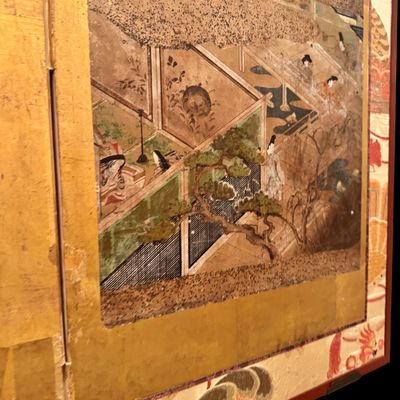 Sale Photo Thumbnail #9: Impressive Japanese eight-panel folding screen featuring hand painted narrative scenes of figures in traditional dress, architecture, and landscapes in muted earth tones with colorful accents. The paintings are framed by gold tone borders, decorative silk