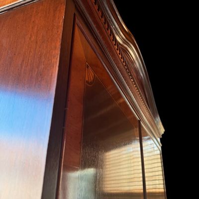 Sale Photo Thumbnail #120: Elegant banded entertainment armoire manufactured in the finest craftsmanship. The beautiful piece is crafted in richly figured wood with a warm finish featuring decorative wood banding along the top, 4 upper drawers and 4 spacious drawers, decorative bra