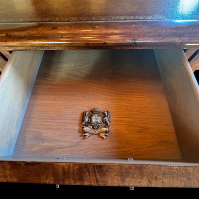 Sale Photo Thumbnail #64: This is a stunning Theodore Alexander partners style writing desk constructed with solid mahogany wood with a beautiful leather tooled top. A rich warm finish showcases the natural grain pattern. The front features a series of 4 drawers equipped with orna