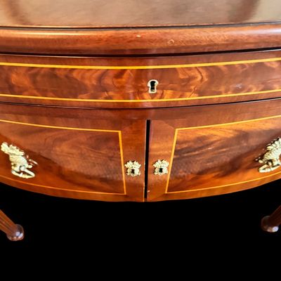Sale Photo Thumbnail #85: Elegant and high quality Kindel Furniture sideboard executed in the Federal Style with refined neoclassical elements. It features a bow front design, characteristic of the period with flame mahogany veneers, and contrasting stringing inlay. The piece is s