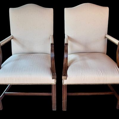 Sale Photo Thumbnail #142: Handsome pair of Chippendale style arm chairs featuring a high, slightly arched back and fluted, dark stained wooden arms and legs. The chairs are upholstered in a neutral chevron pattern fabric, accented with decorative brass tone nailhead trim along the