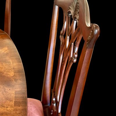 Sale Photo Thumbnail #61: Set of 8 Maitland Smith mahogany Chippendale style dining chairs. High quality craftsmanship with fine carved detail. Knuckle arms with pierced shell covered backs. 
Condition:: Excellent, like new, original finish
Dimensions: 26”W x 22.5”D x 40”H
A