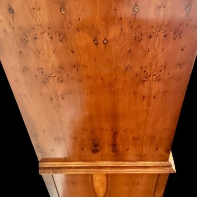 Sale Photo Thumbnail #115: This exquisite Queen Anne style highboy features a classic bonnet-top (or swan's neck) pediment adorned with a central carved shell motif and finials. The piece is constructed with rich, figured walnut veneers, showcasing intricate grain patterns across t