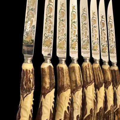Sale Photo Thumbnail #222: Cutlery makers in the town of Solingen, Germany, produced specialized hunting flatware with natural horn handles for export and domestic markets. These sets were crafted during the mid-20th century to satisfy a strong demand for rustic, outdoor-themed din
