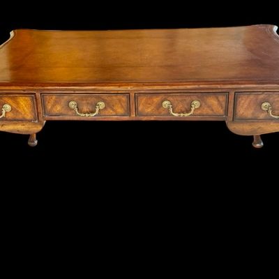 Sale Photo Thumbnail #65: This is a stunning Theodore Alexander partners style writing desk constructed with solid mahogany wood with a beautiful leather tooled top. A rich warm finish showcases the natural grain pattern. The front features a series of 4 drawers equipped with orna