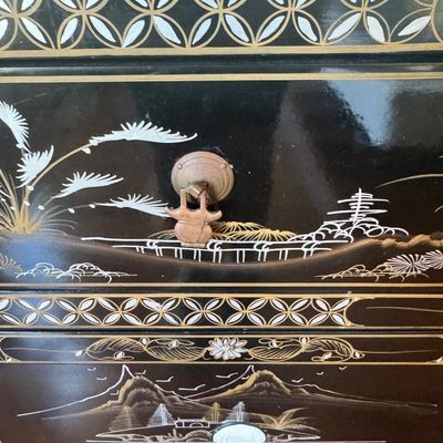 Sale Photo Thumbnail #183: A large black lacquer and mother-of-pearl inlaid figural sideboard depicting the popular “Royal Ladies” narrative scene. Constructed with four central cabinet doors and four upper drawers. The craftsmanship reflects the traditional East Asian furnitur