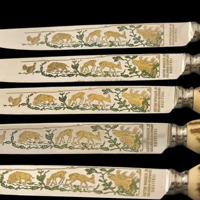 Sale Photo Thumbnail #224: Cutlery makers in the town of Solingen, Germany, produced specialized hunting flatware with natural horn handles for export and domestic markets. These sets were crafted during the mid-20th century to satisfy a strong demand for rustic, outdoor-themed din