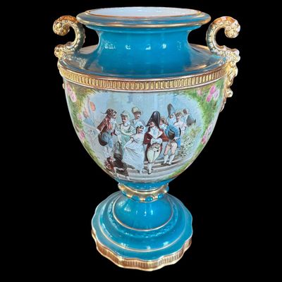 Sale Photo Thumbnail #244: This large decorative French urn features a vibrant teal glazed neck and base, accented with ornate gilded details and handles. The body is decorated with a detailed, hand painted 18th century courting scene. Neo classical design from the late 19th/early 