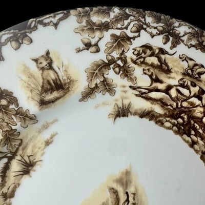 Sale Photo Thumbnail #207: Aiken Hunt dinnerware collection is a timeless pattern inspired by the fox hunting scene of Aiken, South Carolina. Made of porcelain, each piece is hand-decorated and depicts either the Fox or the Hound is an attractive soft brown. Image of running fox an