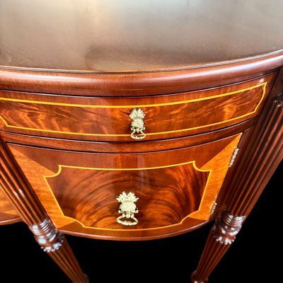 Sale Photo Thumbnail #88: Elegant and high quality Kindel Furniture sideboard executed in the Federal Style with refined neoclassical elements. It features a bow front design, characteristic of the period with flame mahogany veneers, and contrasting stringing inlay. The piece is s