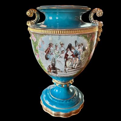 Sale Photo Thumbnail #245: This large decorative French urn features a vibrant teal glazed neck and base, accented with ornate gilded details and handles. The body is decorated with a detailed, hand painted 18th century courting scene. Neo classical design from the late 19th/early 