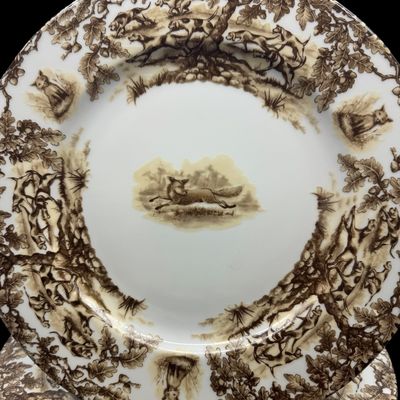 Sale Photo Thumbnail #205: Aiken Hunt dinnerware collection is a timeless pattern inspired by the fox hunting scene of Aiken, South Carolina. Made of porcelain, each piece is hand-decorated and depicts either the Fox or the Hound is an attractive soft brown. Image of running fox an