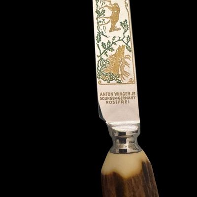 Sale Photo Thumbnail #225: Cutlery makers in the town of Solingen, Germany, produced specialized hunting flatware with natural horn handles for export and domestic markets. These sets were crafted during the mid-20th century to satisfy a strong demand for rustic, outdoor-themed din