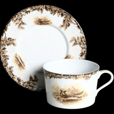 Sale Photo Thumbnail #199: Aiken Hunt dinnerware collection is a timeless pattern inspired by the fox hunting scene of Aiken, South Carolina. Made of porcelain, each piece is hand-decorated and depicts either the Fox or the Hound is an attractive soft brown. Image of running fox an