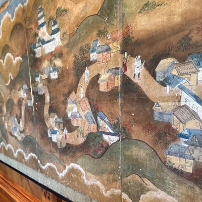 Sale Photo Thumbnail #29: Beautiful antique Japanese six panel folding screen, believed to be dated to the late 19th or early 20th century, featuring a continuous hand painted landscape depicting Mount Fuji, traditional villages, pagodas, winding waterways, and rolling mountains b