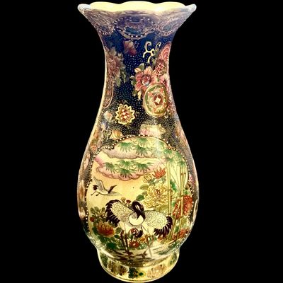 Sale Photo Thumbnail #260: Chinese Satsuma earthenware characterized by its crackle glaze and dense, polychrome enamel decoration. The vase features a lobed rim and a classic baluster form. The body is adorned with intricate scenes including cranes~ a symbol of longevity, flower mo