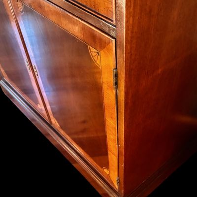 Sale Photo Thumbnail #123: Elegant banded entertainment armoire manufactured in the finest craftsmanship. The beautiful piece is crafted in richly figured wood with a warm finish featuring decorative wood banding along the top, 4 upper drawers and 4 spacious drawers, decorative bra