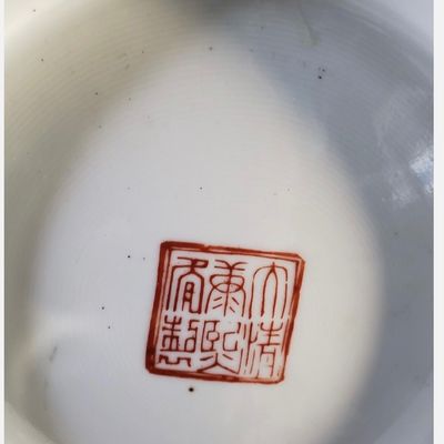 Sale Photo Thumbnail #255: Pair of large, decorative Chinese porcelain vase featuring a black-ground ‘Famille Noire’ palette. The vase showcases intricate polychrome enamel decoration, depicting courtly figures in a garden setting, framed by dense floral and foliate patterns on