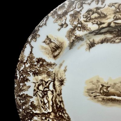 Sale Photo Thumbnail #208: Aiken Hunt dinnerware collection is a timeless pattern inspired by the fox hunting scene of Aiken, South Carolina. Made of porcelain, each piece is hand-decorated and depicts either the Fox or the Hound is an attractive soft brown. Image of running fox an