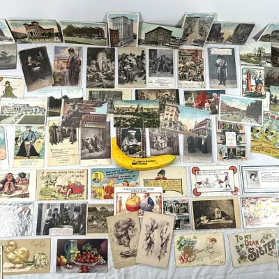 Sale Photo Thumbnail #15: Large collection of vintage and antique postcards featuring scenic views, illustrations, and novelty designs.