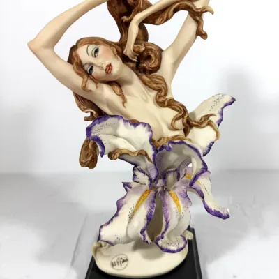 Sale Photo Thumbnail #5: Giuseppe Armani Florence figurine 'Iris', depicting a nude woman emerging from a purple and white iris flower on a wooden base.