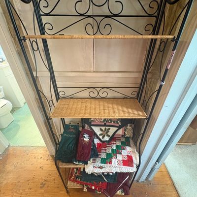 Sale Photo Thumbnail #84: Bakers rack and holiday linens.