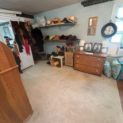 Sale Photo Thumbnail #28: Primary Bedroom with quality clothing.