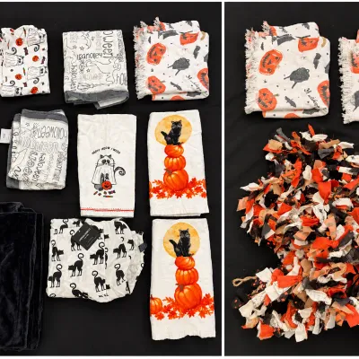 Collection of Halloween-themed linens including kitchen towels, cloth napkins, a black plush 'Feeling Wicked' throw blanket,...