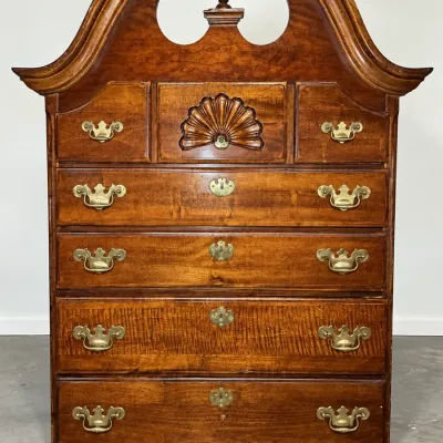 Antique Colonial Revival Chippendale-style highboy top with broken arch pediment, carved shell motif, and brass batwing hardware.