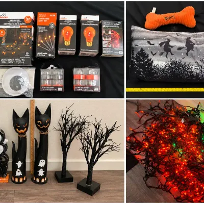 Collection of Halloween decorations including boxed string lights, decorative light bulbs, a witch-themed accent pillow, wooden black cat...