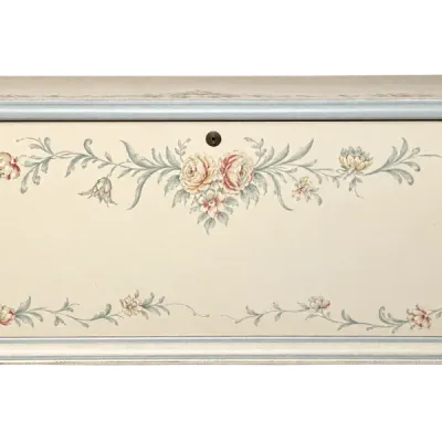 Hand-painted vintage cedar storage chest featuring delicate floral vines on an off-white finish with light blue trim.