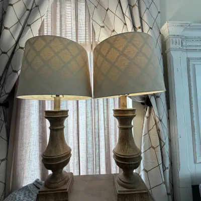 Pair of rustic baluster-style table lamps with weathered wood-look bases and patterned fabric shades.