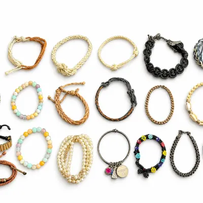 Large collection of eighteen assorted casual bracelets, featuring beaded, braided cord, faux pearl strand, charm bangle, and puka shell...
