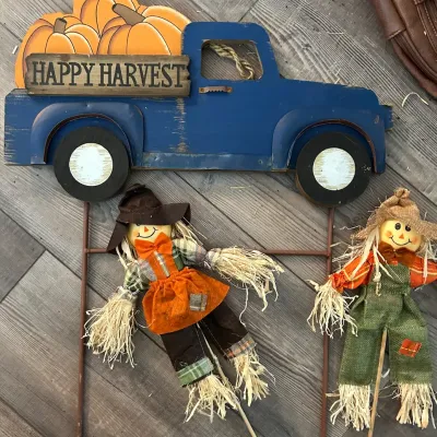 Autumn decorative lawn stakes featuring a blue wooden pickup truck with pumpkins reading 'Happy Harvest' and two small fabric...