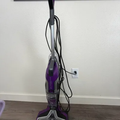 Bissell CrossWave Pet Pro multi-surface wet dry vacuum cleaner in purple and silver casing.